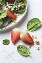Strawberries in the fresh, vitamin-rich, summer salad. Green healthy food, home cooking