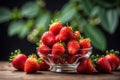 Strawberries in a glass bowl on a wooden table Royalty Free Stock Photo