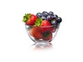 Strawberries and Grapes in glass bowl isolated on white background Royalty Free Stock Photo