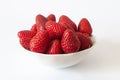 Strawberries, juicy, sweet and beautiful red strawberries in bowl, isolated on white background, selective focus Royalty Free Stock Photo