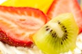 Strawberries kiwi and slice of peach Royalty Free Stock Photo