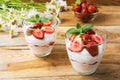 Strawberries layered cream cheese dessert on wooden background Royalty Free Stock Photo