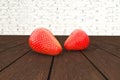 Strawberries lying on wooden table. 3d illustration.