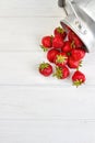 Strawberries in metal bucket and copy space. Royalty Free Stock Photo