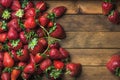 Strawberries over natural wooden background Royalty Free Stock Photo