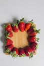 Strawberries over natural wooden background. Top view, copy space Royalty Free Stock Photo