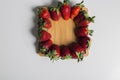 Strawberries over natural wooden background. Top view, copy space Royalty Free Stock Photo