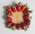 Strawberries over natural wooden background. Top view, copy space Royalty Free Stock Photo