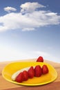 Strawberries And Peeld-Off Banana On Yellow Plate Royalty Free Stock Photo