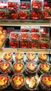 Strawberries in plastic boxes at the grocery store counter Royalty Free Stock Photo