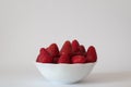 Strawberries, profile view of sweet, tasty red strawberries in white bowl. Royalty Free Stock Photo