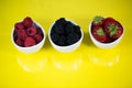 Strawberries, rasberries and blackberries in a bowl