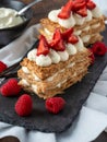 Strawberries, raspberry and Cream Mille Feuille dessert on black stone plate Royalty Free Stock Photo