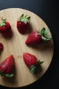 Strawberries on round wood tray