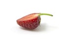 Strawberries in section lies sideways isolated on a white background. Full focus