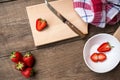 Strawberries sliced on chopping board Royalty Free Stock Photo