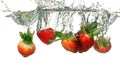 Strawberries Splashing into Water Royalty Free Stock Photo