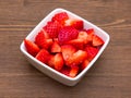 Strawberries on square bowl on wood Royalty Free Stock Photo