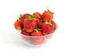 Strawberries in a transparent bowl isolated on a white background closeup. Sweet juicy berries. Copy space. Fresh organic food Royalty Free Stock Photo