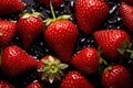 Strawberries and water on black background, fresh and tasty fruit, close up shot, healthy food fresh from the farm concept. Royalty Free Stock Photo