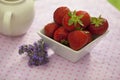 Strawberries in a white angled bowl