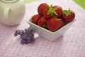 Strawberries in a white angled bowl