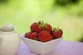 Strawberries in a white angled bowl