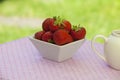 Strawberries in a white angled bowl