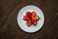 Strawberries on a white plate on a wooden table. creeative background concept.  - Image Royalty Free Stock Photo