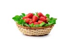 Strawberries in a wicker basket isolated on white background. Free space for text Royalty Free Stock Photo