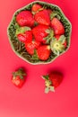 Strawberries in a wooden bowl on the old wooden table Royalty Free Stock Photo