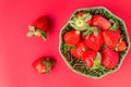 Strawberries in a wooden bowl on the old wooden table Royalty Free Stock Photo