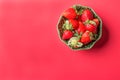 Strawberries in a wooden bowl on the old wooden table Royalty Free Stock Photo