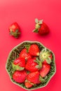 Strawberries in a wooden bowl on the old wooden table Royalty Free Stock Photo