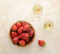 Strawberries in a wooden plate and two glasses of champagne on d Royalty Free Stock Photo