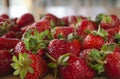 strawberries on wooden table with out of focus home background Royalty Free Stock Photo