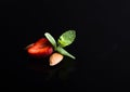 strawberry almon mint isolated on black acrylic background Royalty Free Stock Photo