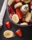 Strawberry banana in a blender ready to blend