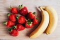 Strawberry banana fruits on wood table Royalty Free Stock Photo