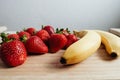 Strawberry banana fruits on wood table Royalty Free Stock Photo