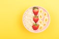 Smoothie bowl on yellow background Royalty Free Stock Photo