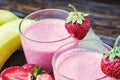 Strawberry and banana smoothie in the glass. Fresh strawberries Royalty Free Stock Photo