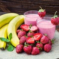 Strawberry and banana smoothie in the glass. Fresh strawberries Royalty Free Stock Photo