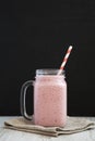 Strawberry banana smoothie in a glass jar mug, side view. Closeup Royalty Free Stock Photo