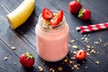 Strawberry and banana smoothie with granola Royalty Free Stock Photo