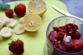 Strawberry and banana smoothie in the jar. Ingredients for making smoothies strawberry banana, frozen berries in a blender on a