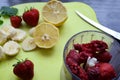 Strawberry and banana smoothie in the jar. Ingredients for making smoothies strawberry banana, frozen berries in a blender on a