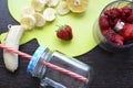 Strawberry and banana smoothie in the jar. Ingredients for making smoothies strawberry banana, frozen berries in a blender on a