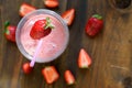 Strawberry Banana Smoothies in Glasses with Ingredients on dark wooden Table