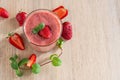 Strawberry Banana Smoothies in Glasses with Ingredients on light wooden Table. Top view Royalty Free Stock Photo